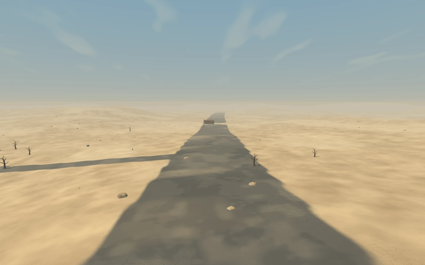 Lighter asphalt, irregular repairs and sand along the route.